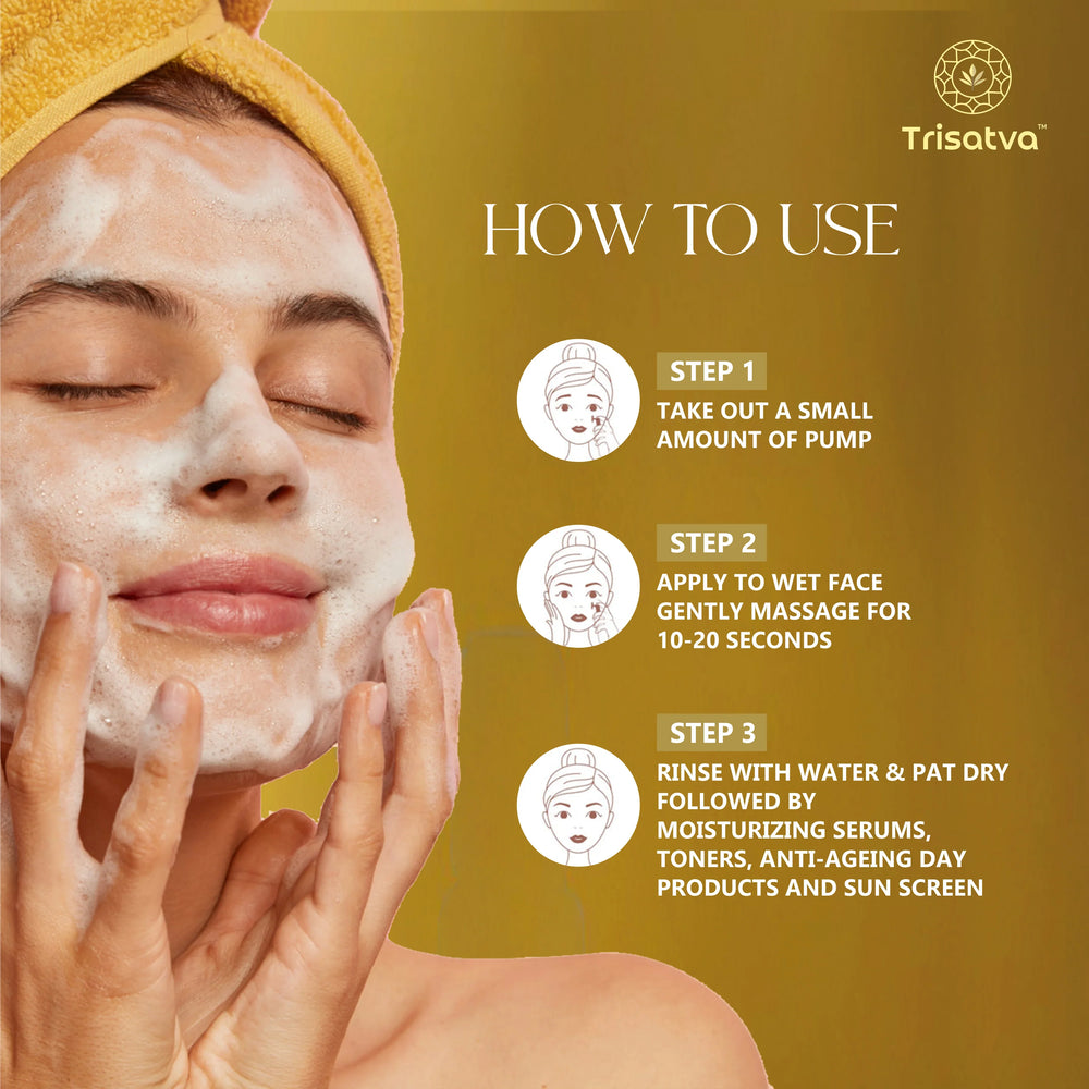 Woman with a yellow headband washing face with foaming cleanser, Trisatva skincare how to use steps