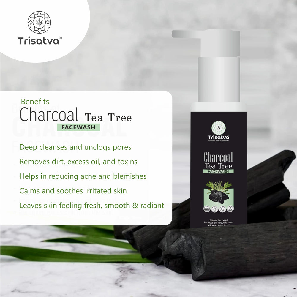 Trisatva Charcoal Tea Tree Facewash bottle on charcoal pieces with skincare benefits text