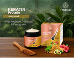 Trisatva Keratin Protein hair mask jar and packaging with wooden comb on wooden surface, natural ingredients background